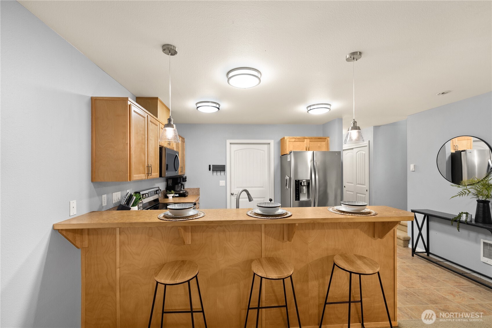 16015 123rd Ave Court East Puyallup, WA 98374 - Photo 13 of 26 a bathroom with a sink and a mirror