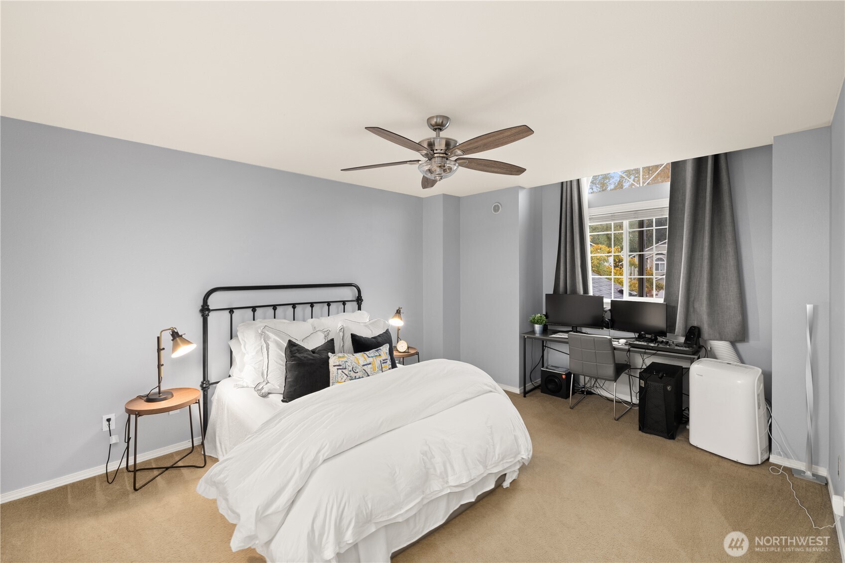 16015 123rd Ave Court East Puyallup, WA 98374 - Photo 15 of 26 a bedroom with a bed and a chandelier