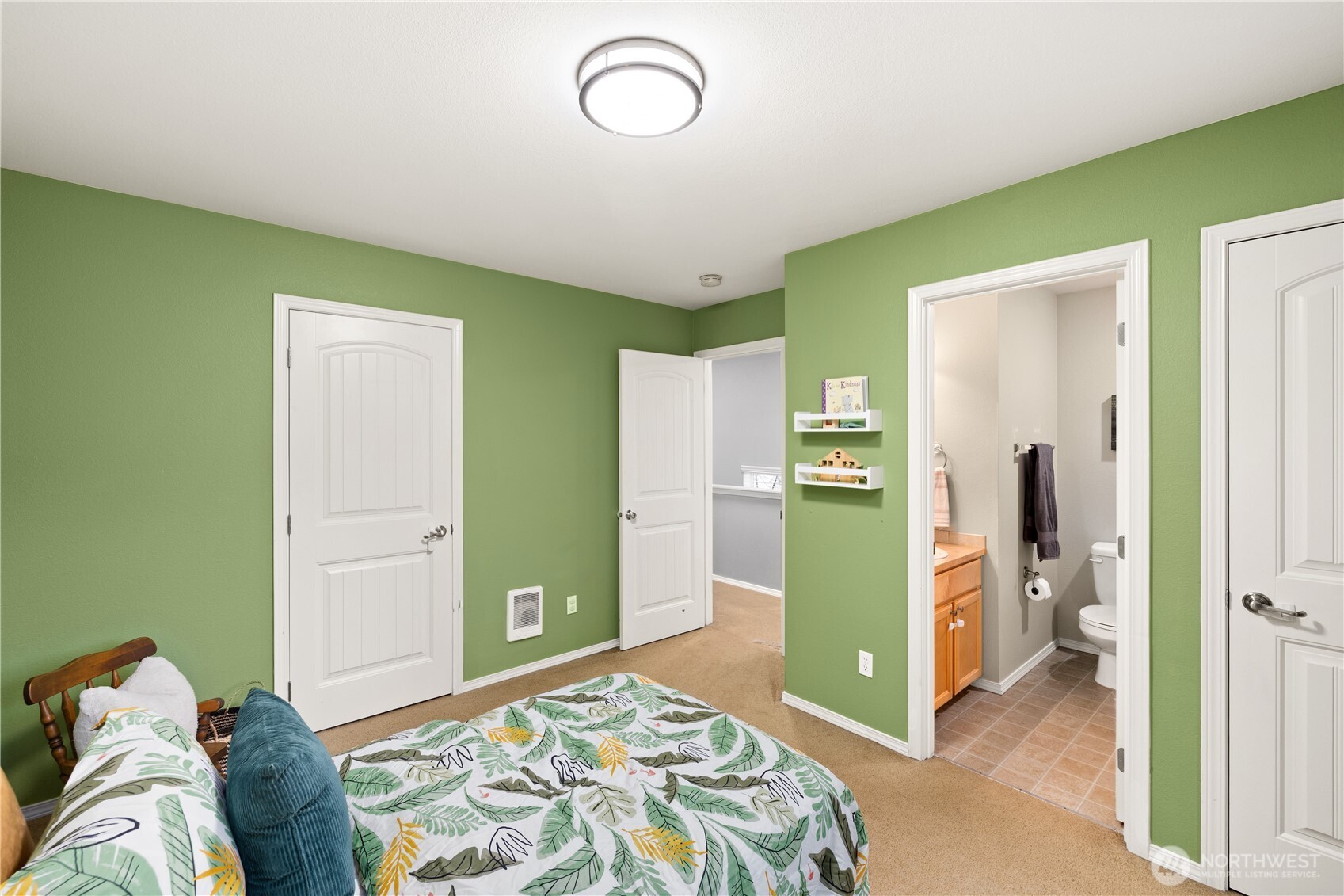 16015 123rd Ave Court East Puyallup, WA 98374 - Photo 18 of 26 a bedroom with a bed and a mirror