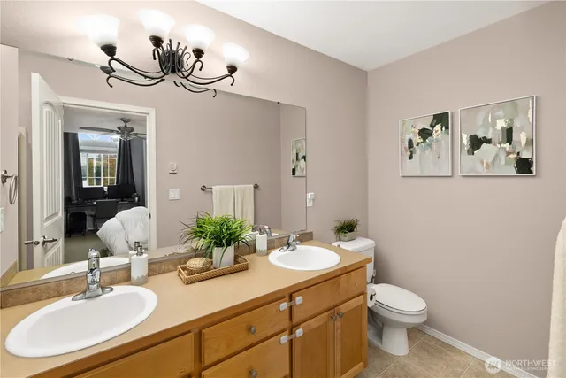 a bathroom with a double vanity sink and a mirror