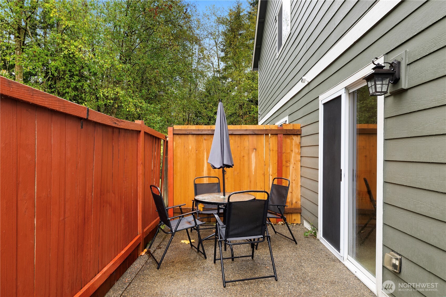 16015 123rd Ave Court East Puyallup, WA 98374 - Photo 23 of 26 a view of a patio with table and chairs and wooden fence