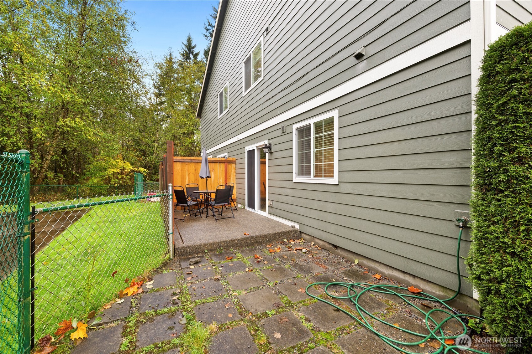 16015 123rd Ave Court East Puyallup, WA 98374 - Photo 24 of 26 a view of a backyard with plants and a patio