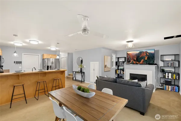 a living room with fireplace furniture and a flat screen tv