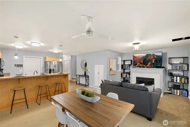 a living room with fireplace furniture and a flat screen tv