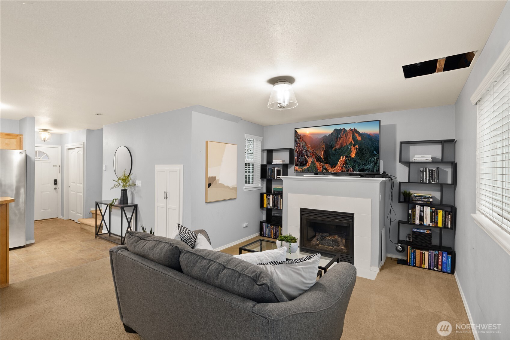 16015 123rd Ave Court East Puyallup, WA 98374 - Photo 5 of 26 a living room with furniture and a fireplace