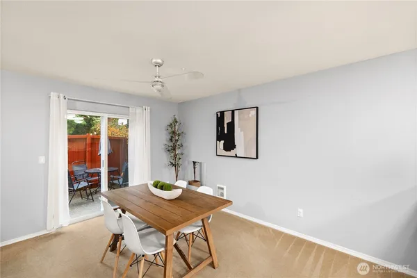 a view of a room with furniture and wooden floor