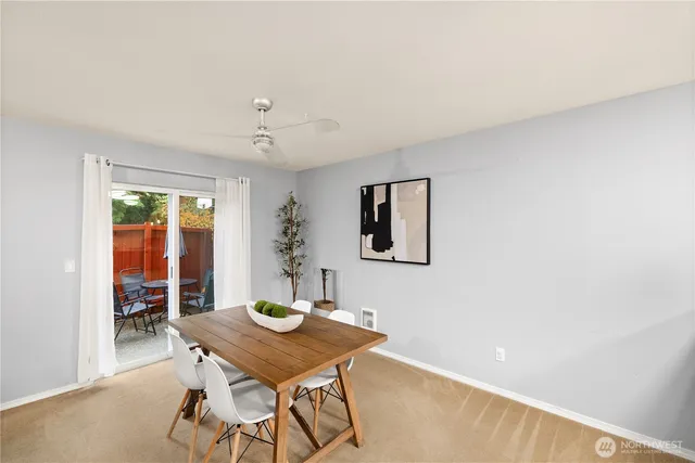 a view of a room with furniture and wooden floor