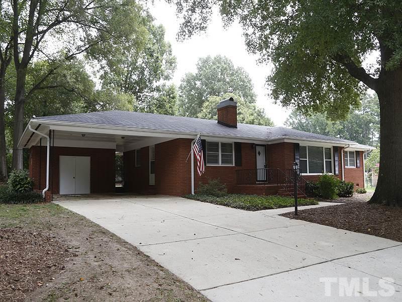 4801 Greenbrier Road Raleigh, NC 27603 - Photo 1 of 12 a front view of a house with garden