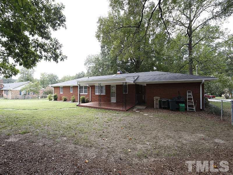 4801 Greenbrier Road Raleigh, NC 27603 - Photo 11 of 12 a view of a house with a yard