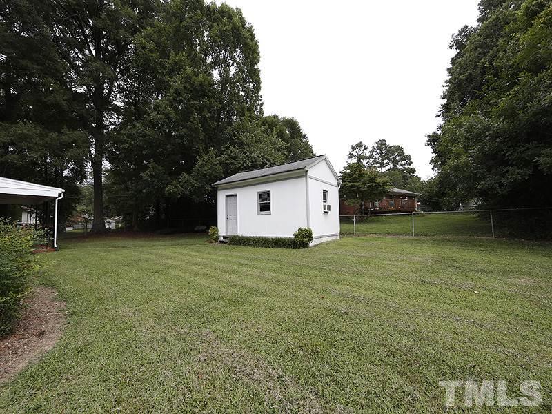 4801 Greenbrier Road Raleigh, NC 27603 - Photo 12 of 12 a view of a backyard with a garden
