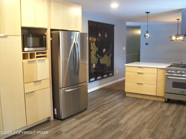 a kitchen with a stove and a sink