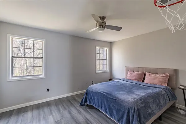 a bedroom with a bed and window