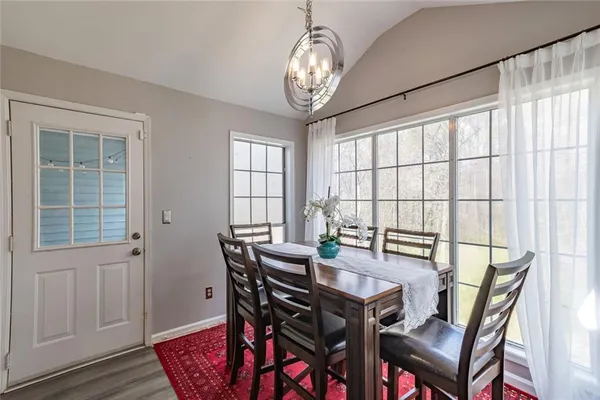 a view of a dining room with furniture window and outside view
