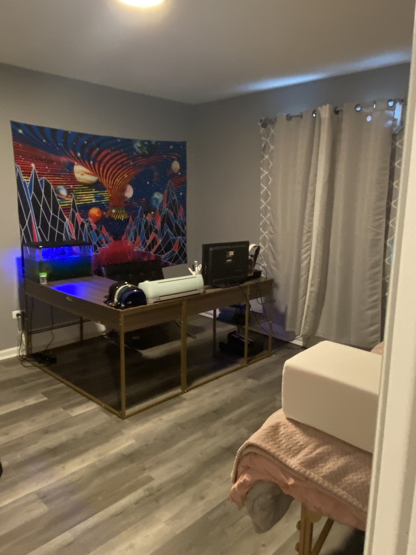 7000 Mather Avenue, Unit 101 Chicago Ridge, IL 60415 - Photo 15 of 21 a bedroom with furniture and a rug