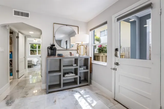 a bathroom with a sink vanity mirror and toilet