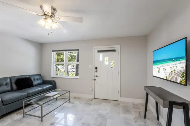 a bedroom with a bed and a table in it with window