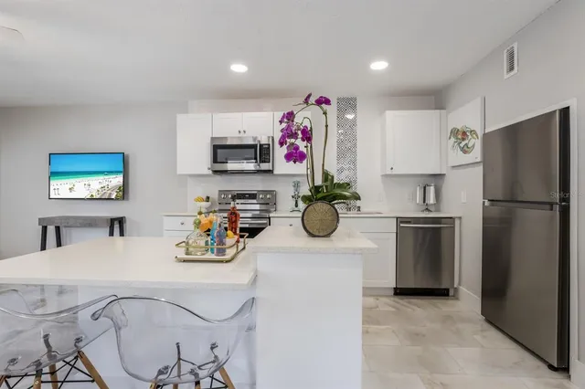 a room with furniture and wooden floor
