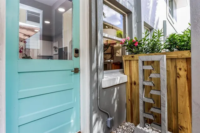 a view of a patio with a table and chairs