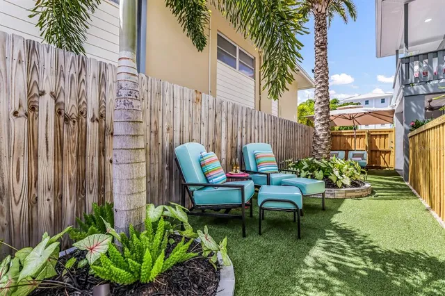a view of outdoor space with lots of furniture and wooden floor