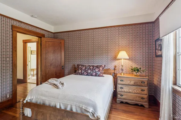 a bedroom with two beds and a couch
