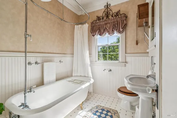 a bathroom with a sink and mirror