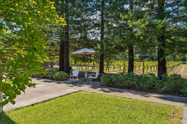 a view of a backyard with sitting area