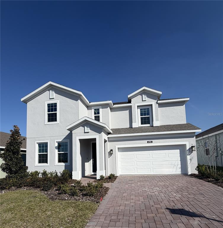 6984 Broad Wing Loop Howey-in-the-Hills, FL 34737 - Photo 1 of 1 a house view with a outdoor space