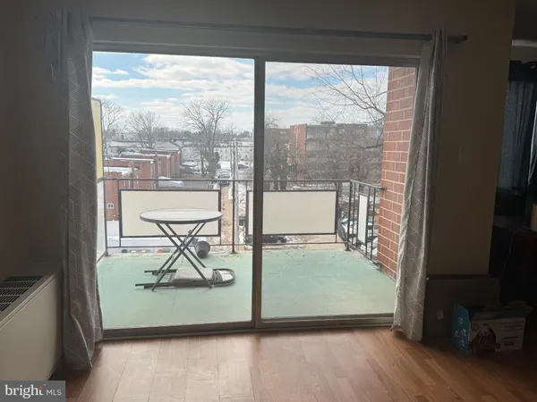 a view of a balcony with chairs and a table