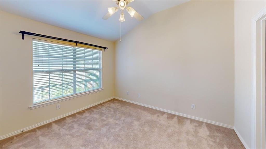18240 Midway Road, Unit 1204 Dallas, TX 75287 - Photo 8 of 27 an empty room with a window