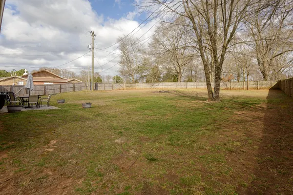 a view of a large yard with a fountain