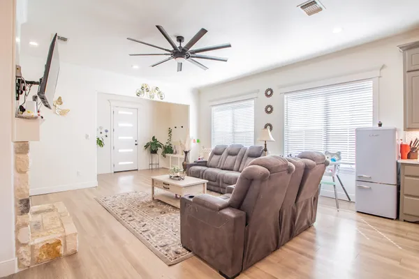 a living room with furniture and a large window