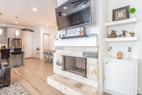 a living room with furniture and a fireplace