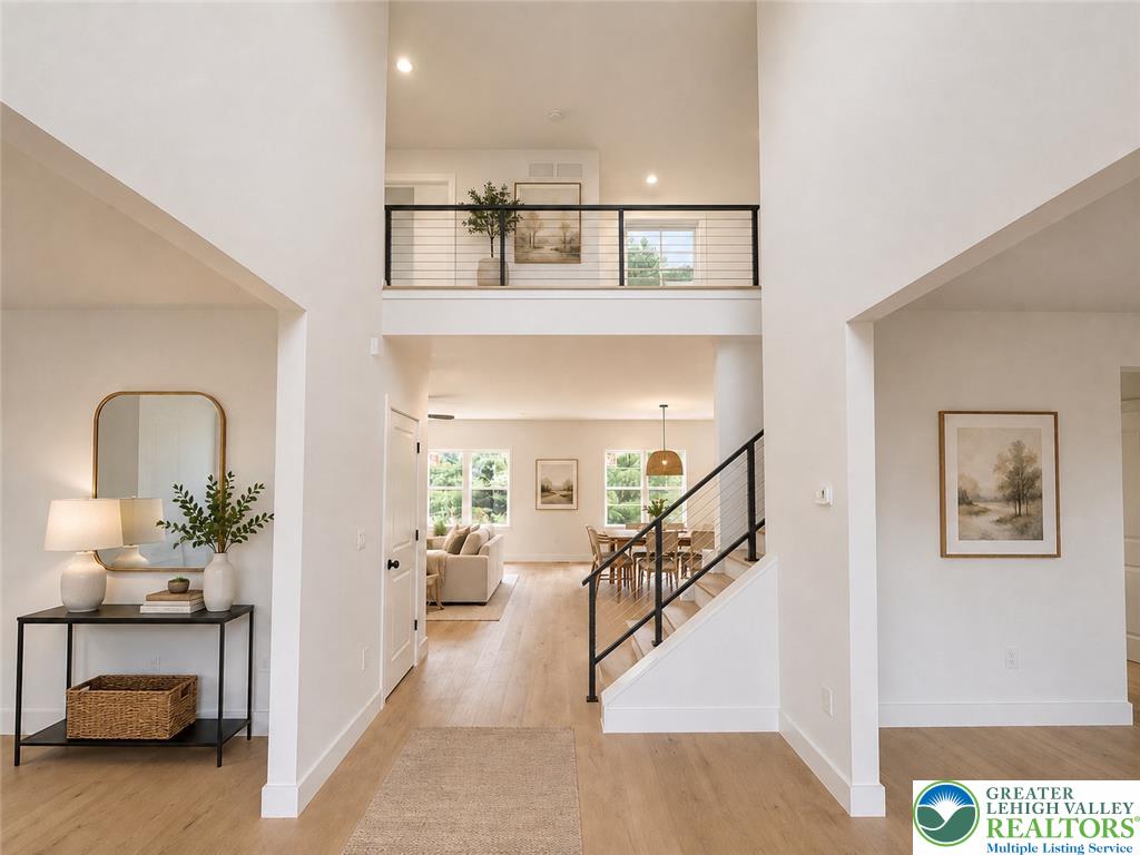 3104 Moyer Road Hellertown, PA 18055 - Photo 23 of 24 Dramatic soaring ceilings and sleek modern railings frame this welcoming two-story entryway floorplan.