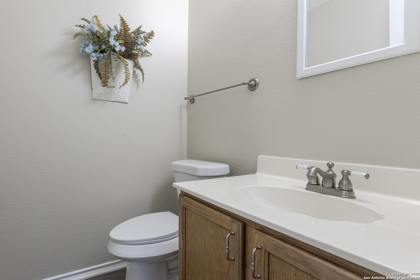 1048 Sycamore Schertz, TX 78154 - Photo 16 of 31 a bathroom with a sink and toilet