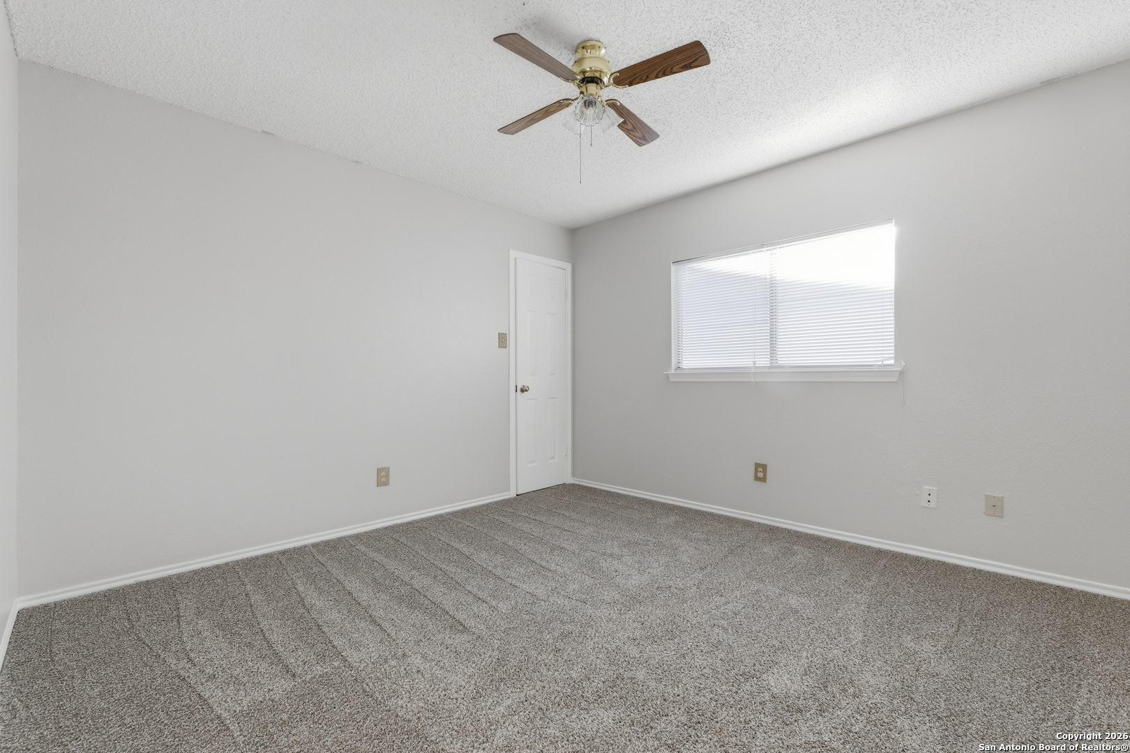 1048 Sycamore Schertz, TX 78154 - Photo 19 of 31 an empty room with a window and a fan