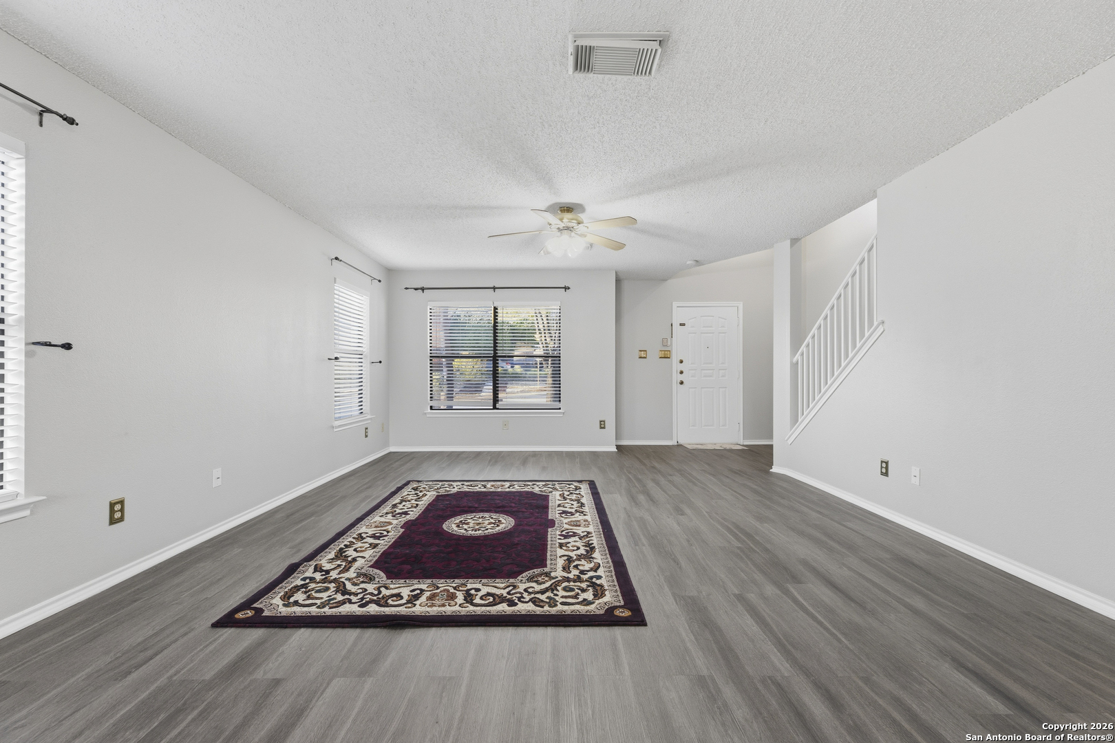 1048 Sycamore Schertz, TX 78154 - Photo 4 of 31 wooden floor in an empty room with a window
