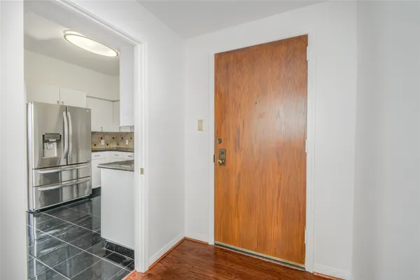 wooden floor in an empty room with window