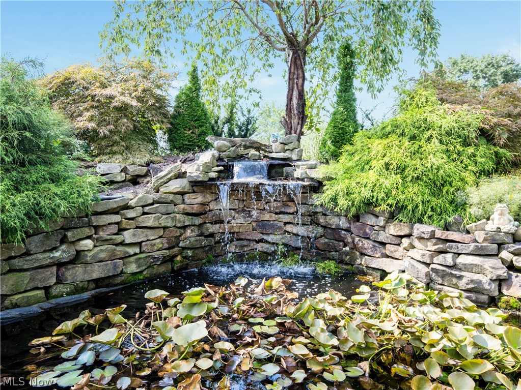 99 Kehner Road Mogadore, OH 44260 - Photo 4 of 35 Tranquil water feature with stacked stone.