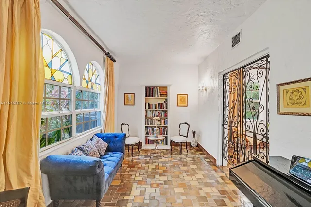 a kitchen with granite countertop a sink stainless steel appliances and cabinets