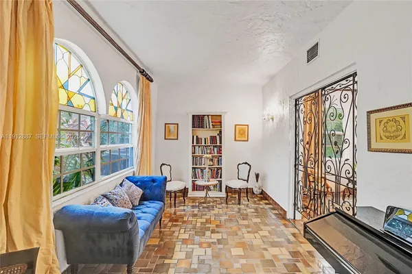 a kitchen with stainless steel appliances a stove a sink and a refrigerator