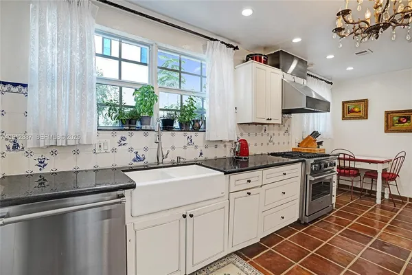 a view of a livingroom with furniture wooden floor and windows