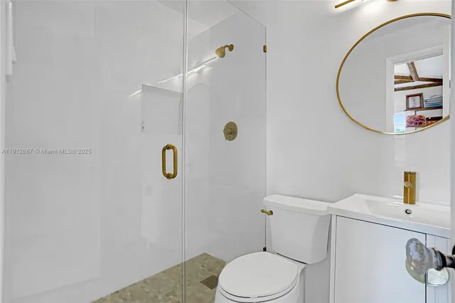 an aerial view of a livingroom with furniture and mirror