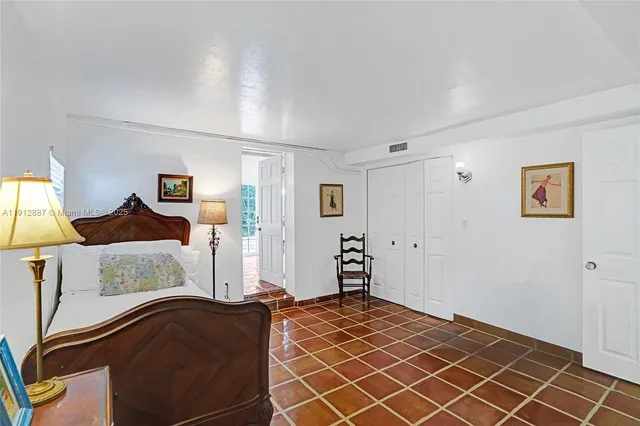 a spacious bathroom with a granite countertop sink a toilet and shower