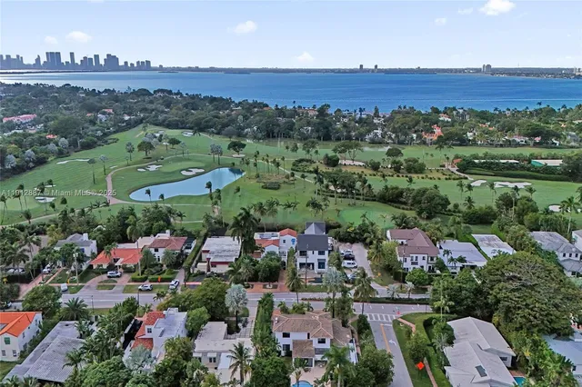 an aerial view of a house with a garden and plants