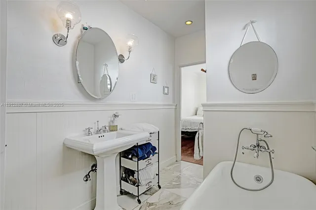 a kitchen with stainless steel appliances a stove a sink and a refrigerator