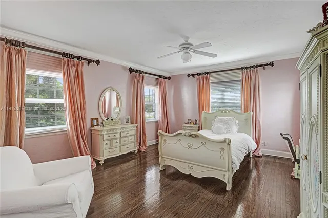 a view of a patio with table and chairs with wooden floor and fence