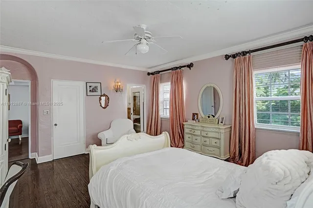 a picture of a room with a white wall and a large window