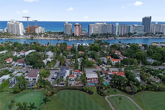 an aerial view of residential houses with outdoor space and street view