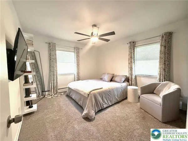 a bedroom with bed and window