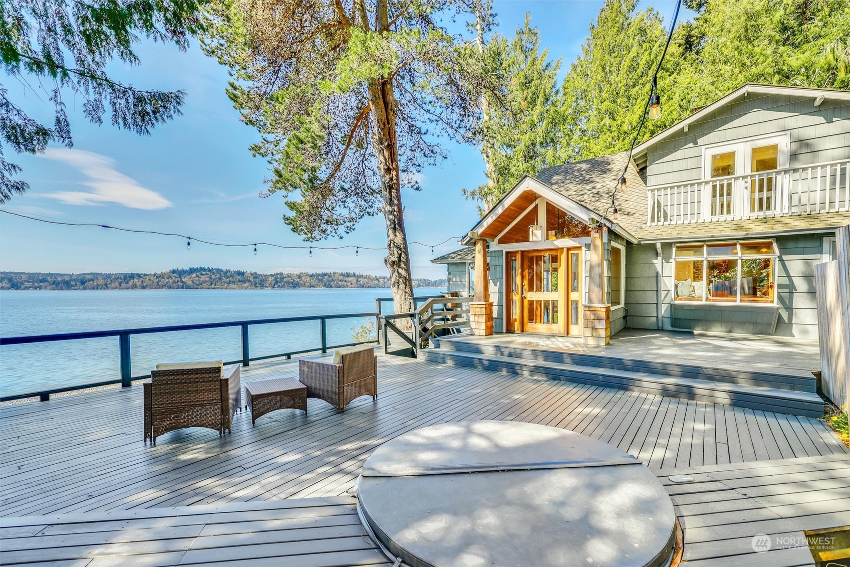 13307 Burma Road Southwest Vashon, WA 98070 - Photo 1 of 39 a view of backyard with table and chairs and wooden fence